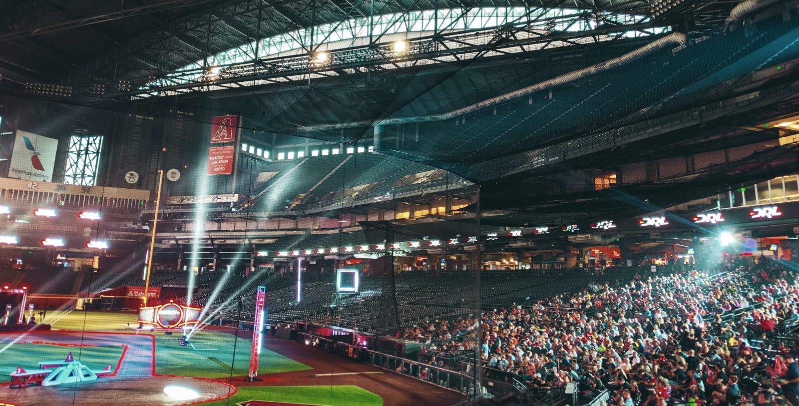 people watching sports inside stadium